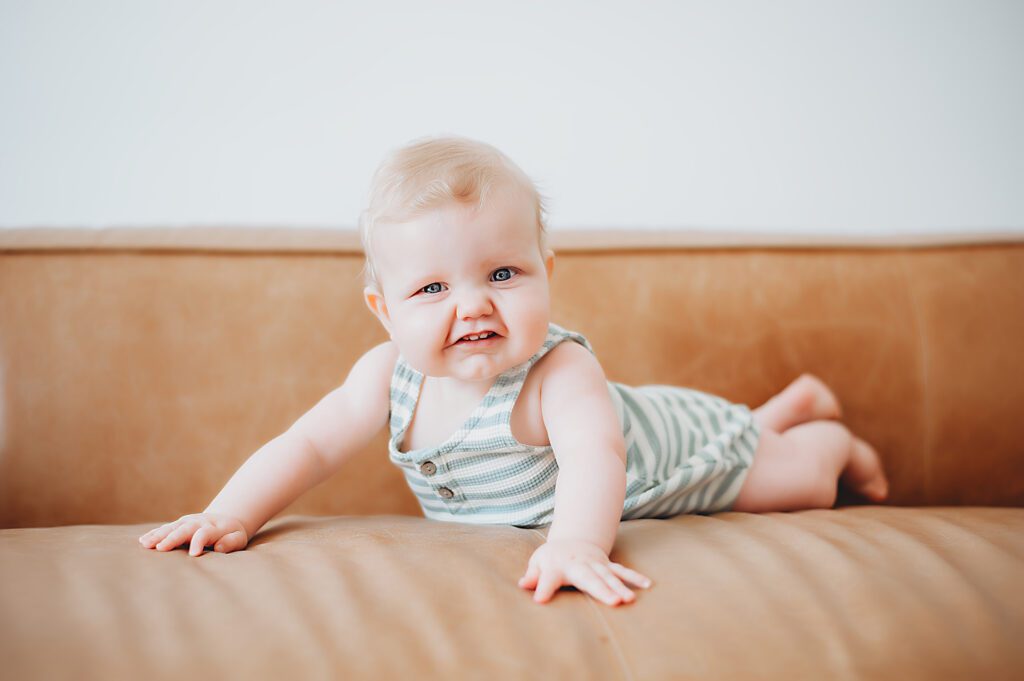 Fort Worth Baby Photography - baby laying on brown couch