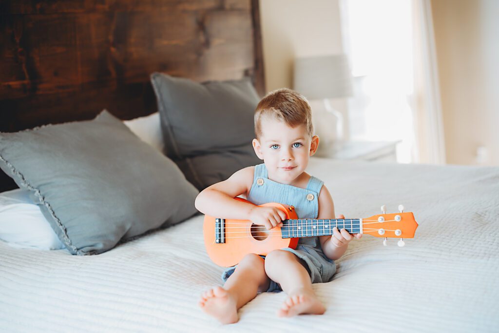 Little boy playing guitar in DFW Lifestyle Photography
