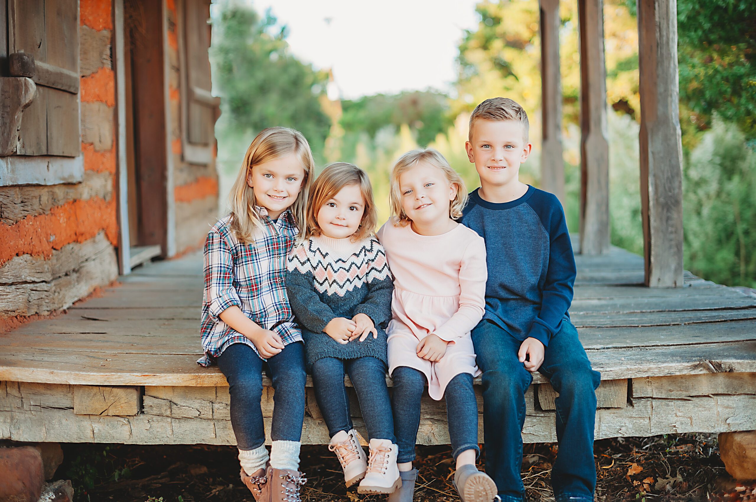 siblings sitting on porch in Texas with Fort Worth family photography Splendor Photography