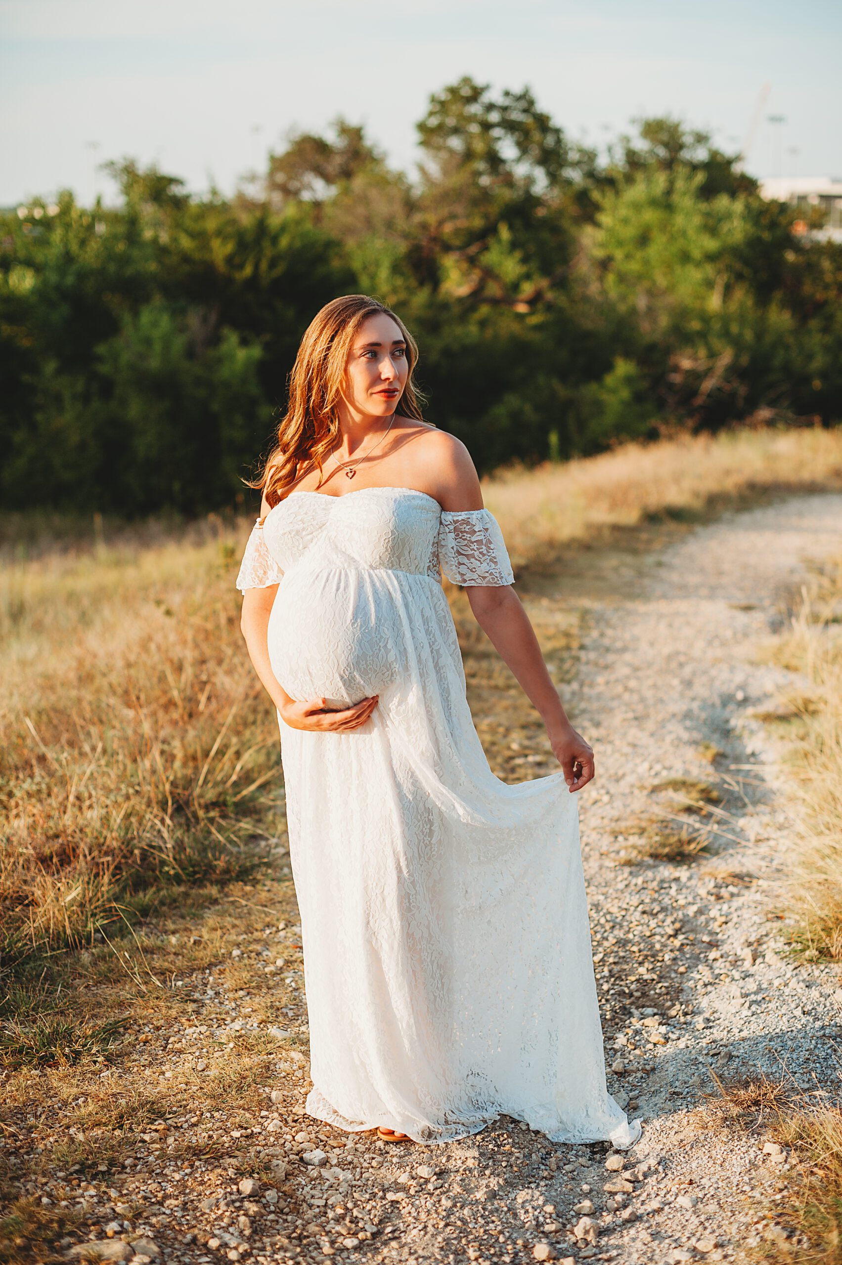 Fort Worth Maternity Photographers | Pregnant woman standing in golden sunlight